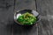 Green chuka seaweed salad in a black bowl