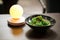 Green chuka seaweed salad on the table with a lamp