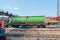 Green cistern of freight train at railway