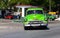 A green classic car cuba