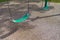 Green classic Sling Swing at kids park with safety rubber flexible flooring