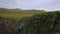 Green cliffs of farroe islands in cloudy weather