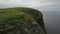 Green cliffs of farroe islands in cloudy weather