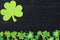 Green Clovers on Chalkboard Background