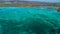 Green Coastline in Corsica with Some Boats