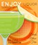 Green cocktail in coupe glass with slice of lime on orange halftone with grunge close up