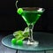 Green cocktail with maraschino cherry in a martini glass