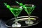 Green cocktail with maraschino cherry in a martini glasses