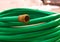 Green coiled rubber hose