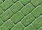 Green color cobblestone pavement surface.