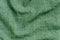 Green color denim textile cloth surface.