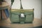 Green color handbags by Prada in a luxury fashion store showroom