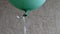Green color helium balloon floating at blurred background with copy space