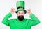 Green color part of celebration. Myth of leprechaun. Happy patricks day. Man bearded hipster wear green clothing and hat