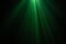 Green color wide lens projector with light beam for movie and cinema at night . smoke texture spotlight . black background