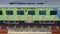 Green colored train coach of the Duronto Express. Superfast journey with Indian Railways.