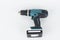 Green cordless hammer screwdriver drill on white background. The tool can be used as a drill hammer or a screwdriver or flat drill