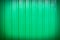 Green corrugated fence