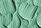 Green cosmetic clay texture close up