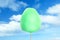 Green cotton candy against sky with clouds