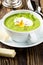 Green cream soup with poached egg