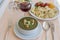 Green cream soup from spinach with croutons, cheese and fresh parsley