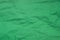 Green creased paper background texture