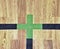 Green cross of lines. Shining floor of sports gymnasium