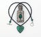Green crystal necklace & perfume bottle isolated