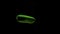 Green cucumber falling into transparent water on black background