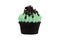 Green cupcake isolated on white background