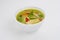 Green curry in a white bowl