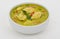 Green curry in a white bowl