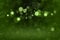 Green cute bright glitter lights defocused bokeh abstract background, festive mockup texture with blank space for your content