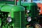 Green czechoslovak historical agricultural diesel tractors from 1950s displayed on expo.