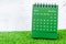 The Green December 2023 Monthly desk calendar for 2023 year on grass