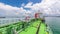 Green deck of the tanker under blue sky timelapse