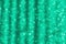 Green defocused background with sparkles. Material for designers defocus light