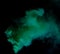 Green Dense Fluffy Puffs of White Smoke and Fog on black Background, Abstract Smoke Clouds, Movement Blurred out of focus. Smoking