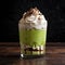 a green dessert with whipped cream and chocolate shavings