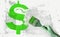 Green dollar sign and brush in hand on grunge white grey background. Currency money financial concept