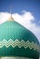 Green dome on mosque building