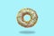 Green donut on on pastel blue background