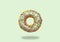 Green donut on on pastel green background