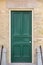 Green Door in Old Yellow Brick Building