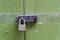 Green door with strong padlock