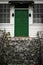 Green double door front entrance at top of stairs/ staircase at a vintage house/home