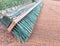 Green drag broom for clay court close up
