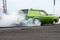 Green drag car burnout