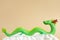 The green dragon statue on light brown background. 2024 New Year. Chinese horoscope,